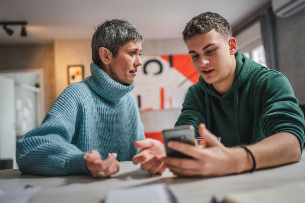 teenage boy having deep conversation with foster parent