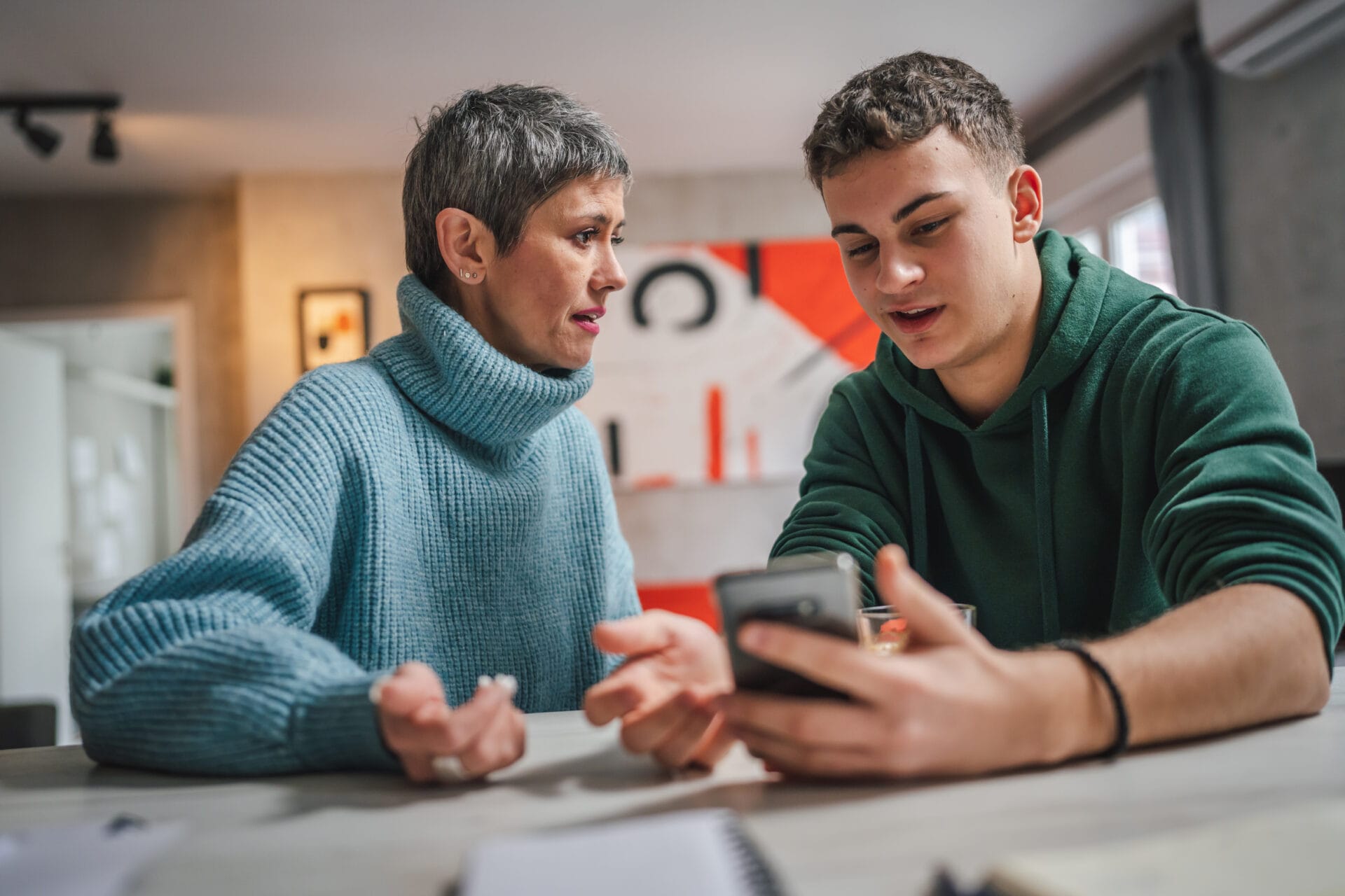 teenage boy having deep conversation with foster parent